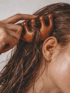 Hair being combed, hair health naturopath Newcastle