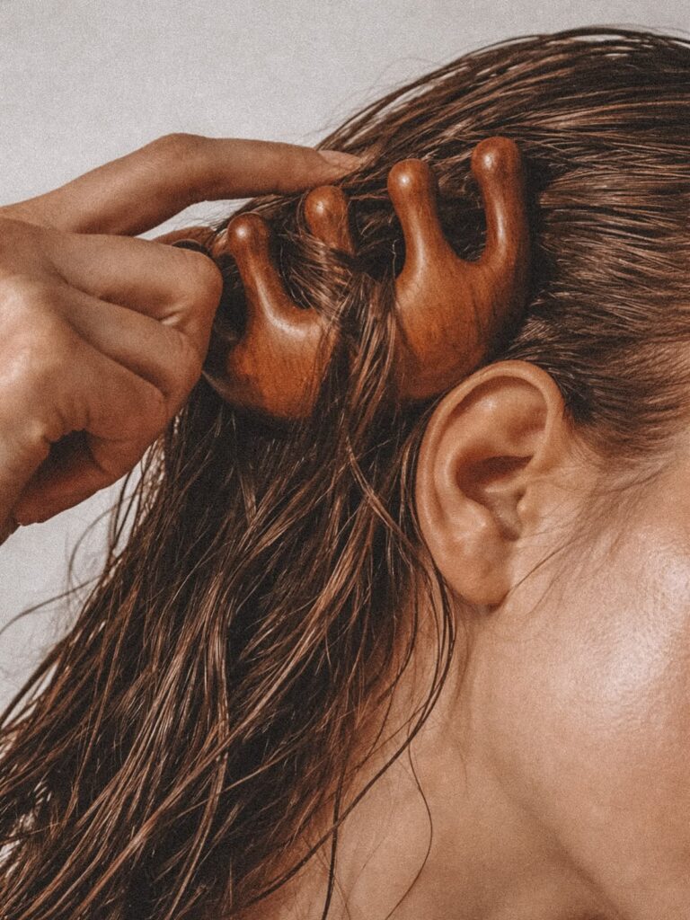 Hair being combed, hair health naturopath Newcastle