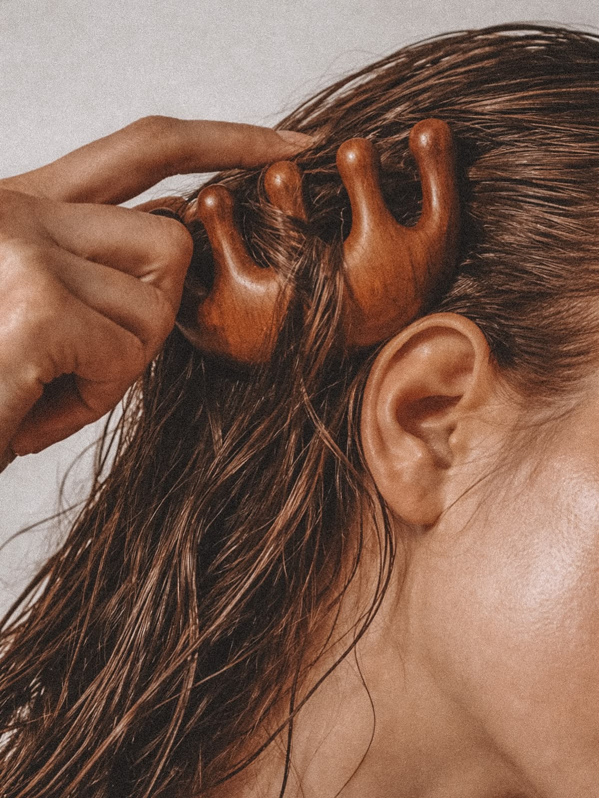 Hair being combed, hair health naturopath Newcastle
